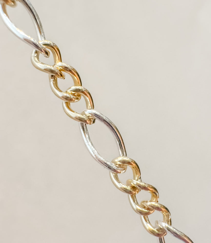 Two Toned Figaro Chain. Large. Priced per inch..