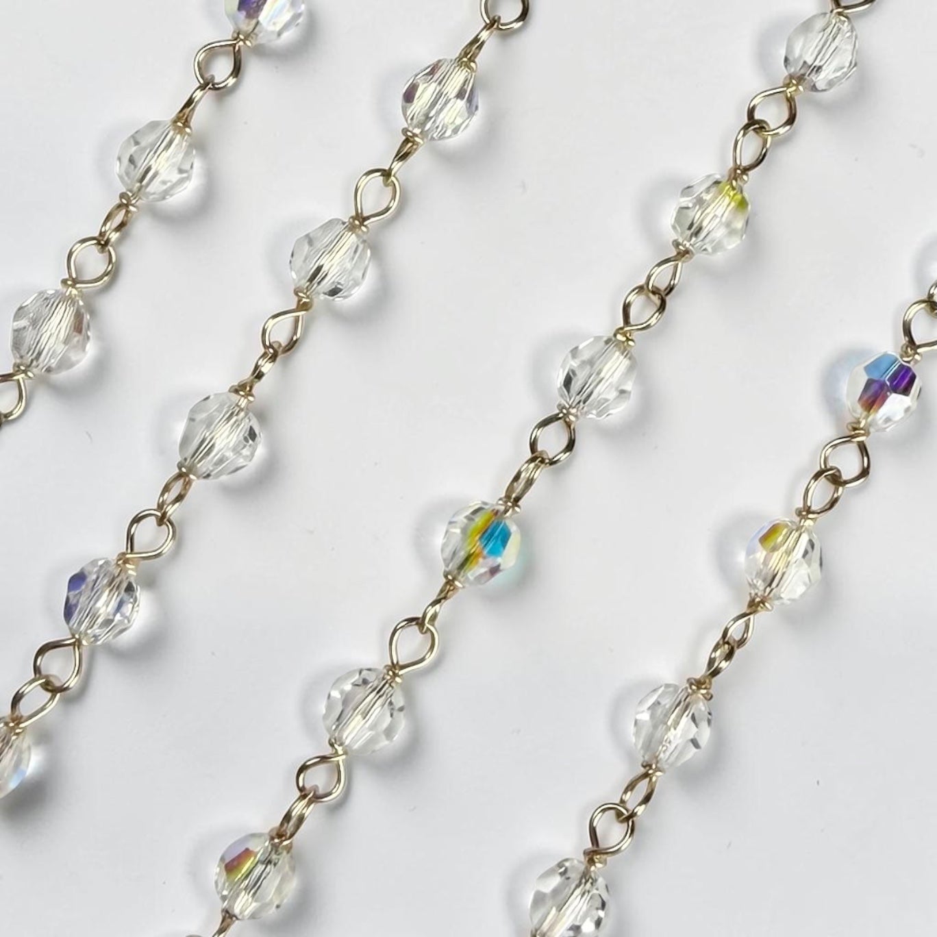 Gold Filled Crystal Chain. Priced per foot. 4mm swarvoski crystal